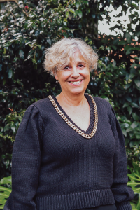 Blonde short haired woman smiling at camera