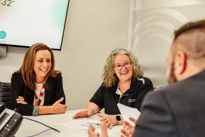 Group of smiling people in an office setting