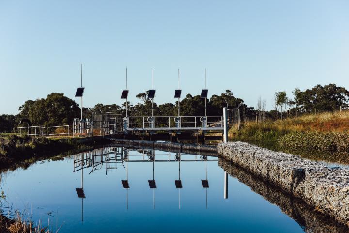 A channel of water leading to solar power channel gates