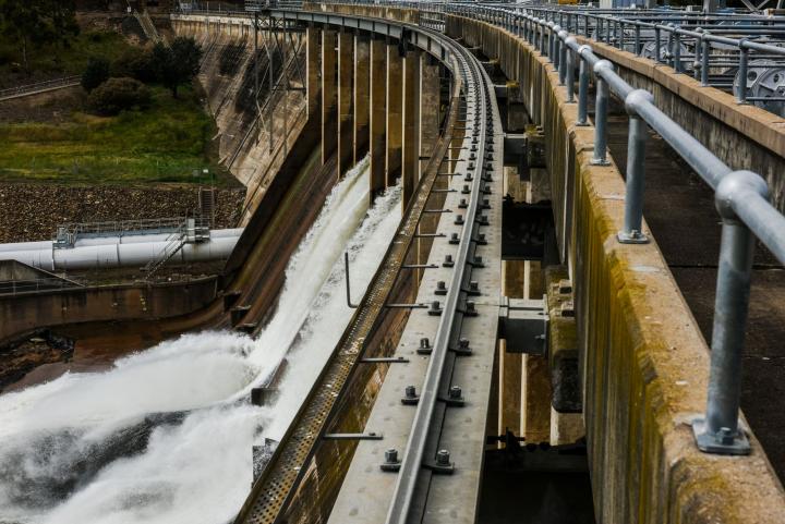 A dam wall spilling water