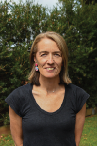 Headshot of smiling woman outside